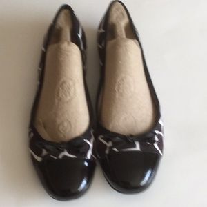 Talbots loafer animal print patent leather shoes.